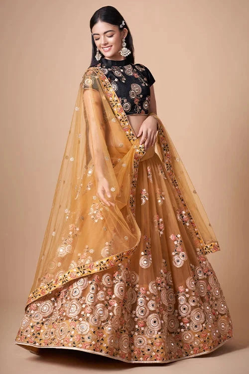 Gold Color Exquisite Soft Net Embellished Lehenga Choli For Festive Fervor