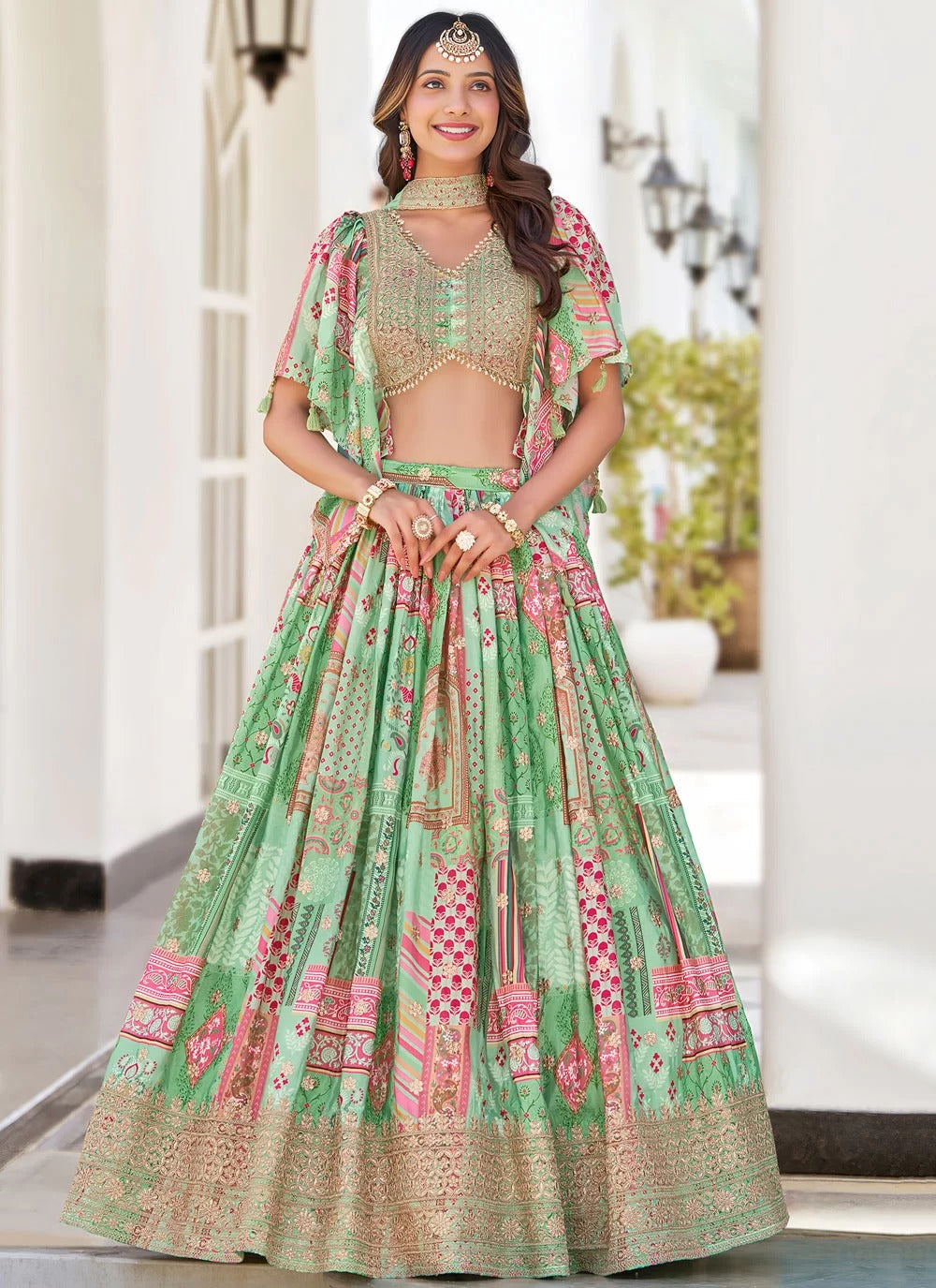Graceful green dori embroidered chinnon silk sangeet special lehenga choli with dupatta