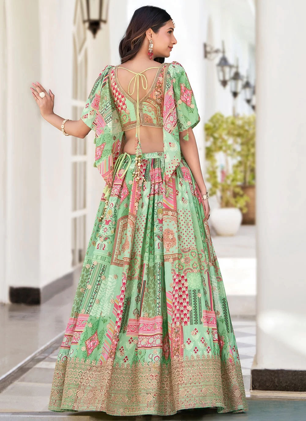 Graceful green dori embroidered chinnon silk sangeet special lehenga choli with dupatta