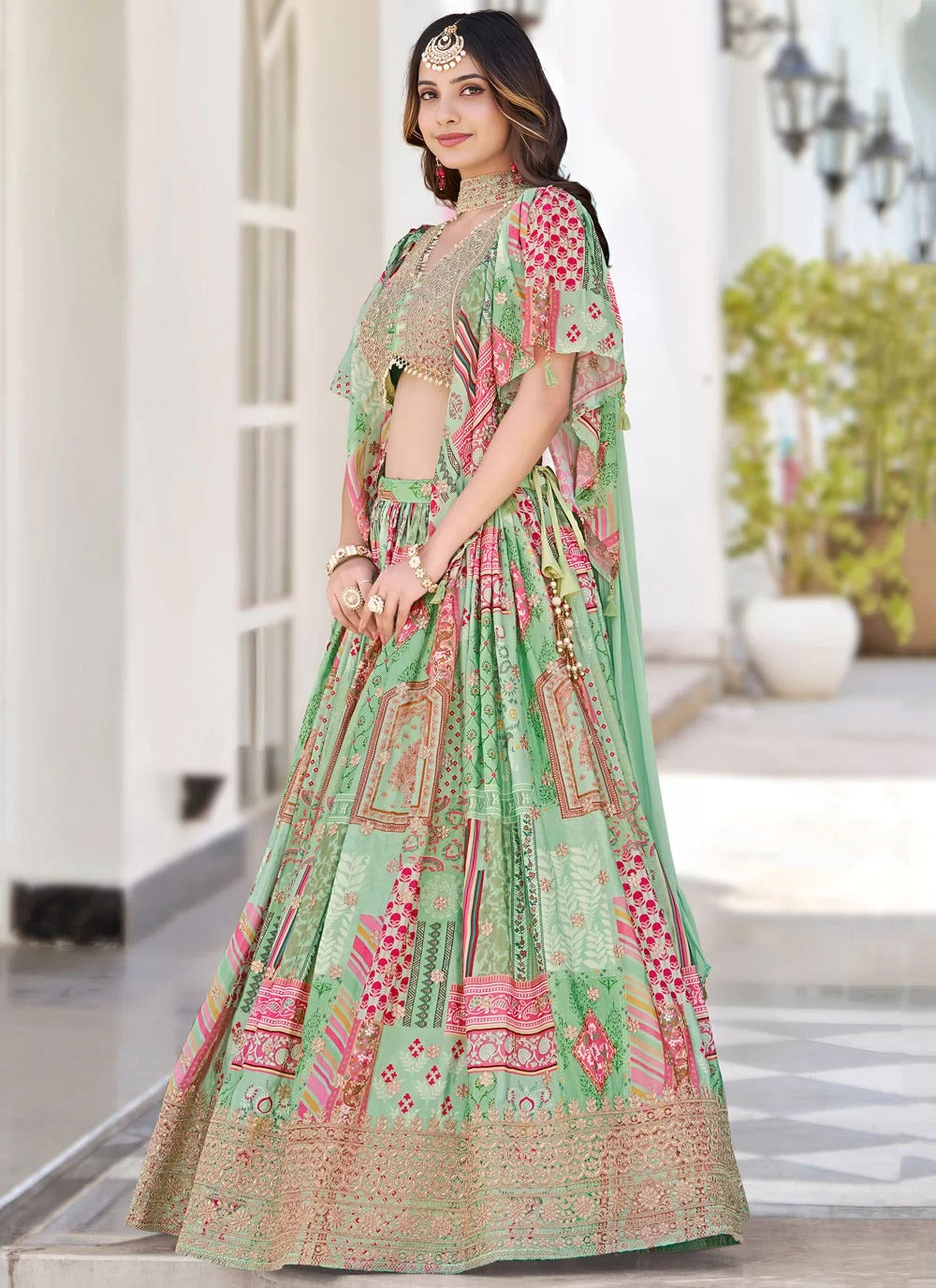 Graceful green dori embroidered chinnon silk sangeet special lehenga choli with dupatta