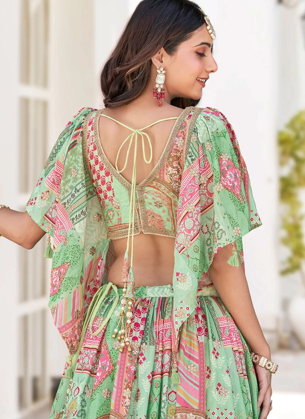 Graceful green dori embroidered chinnon silk sangeet special lehenga choli with dupatta