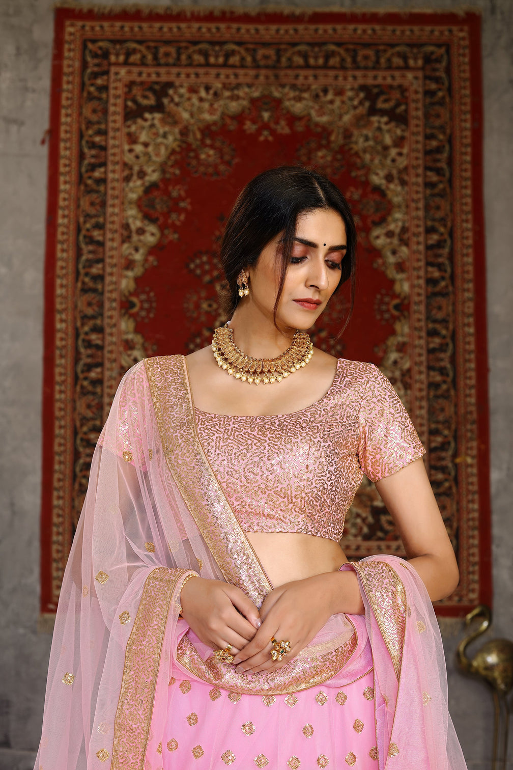 Hypnotizing Pink Sequins Embroidered Net Semi Stitched Lehenga Choli