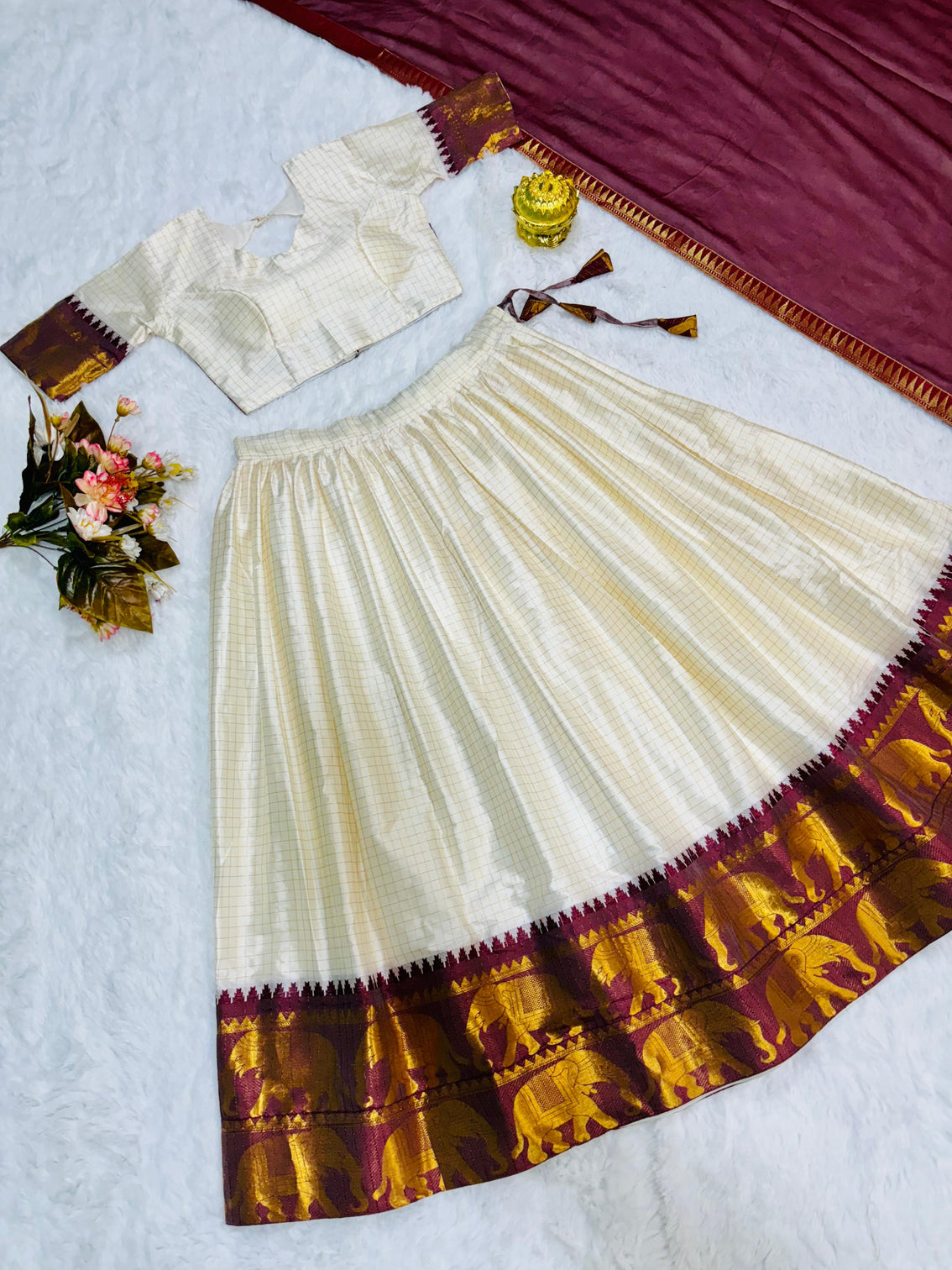 Elegant elephant white checks silk lehenga light shades to complement to create beautiful aura in all function
