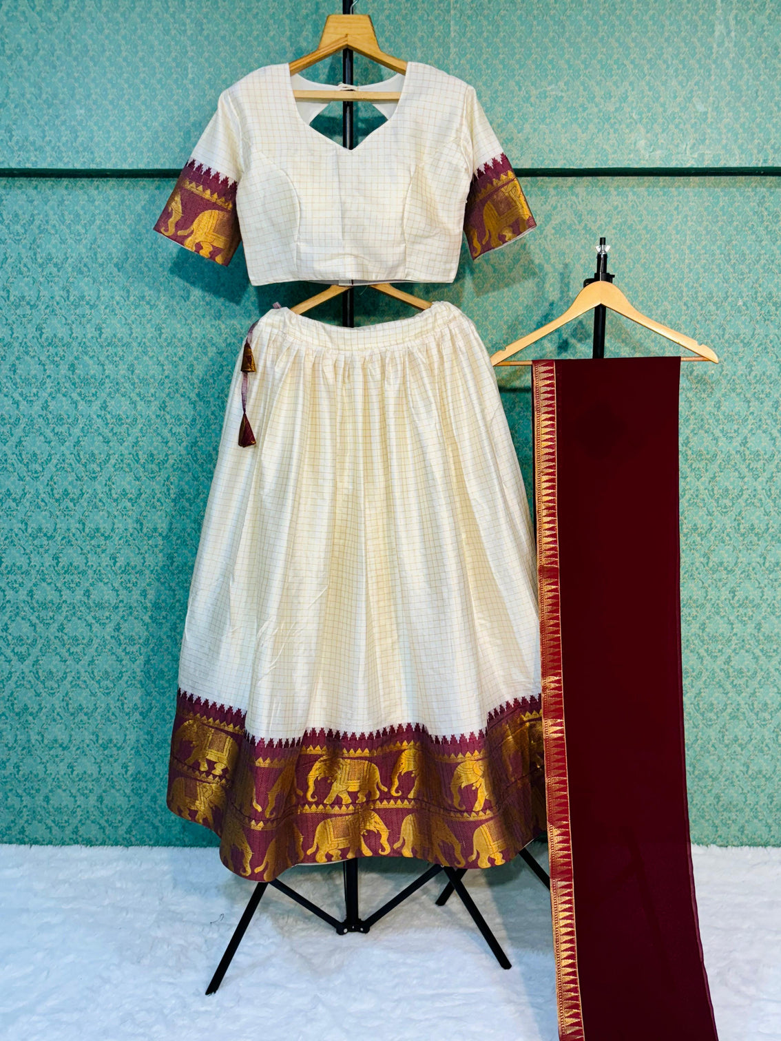 Elegant elephant white checks silk lehenga light shades to complement to create beautiful aura in all function
