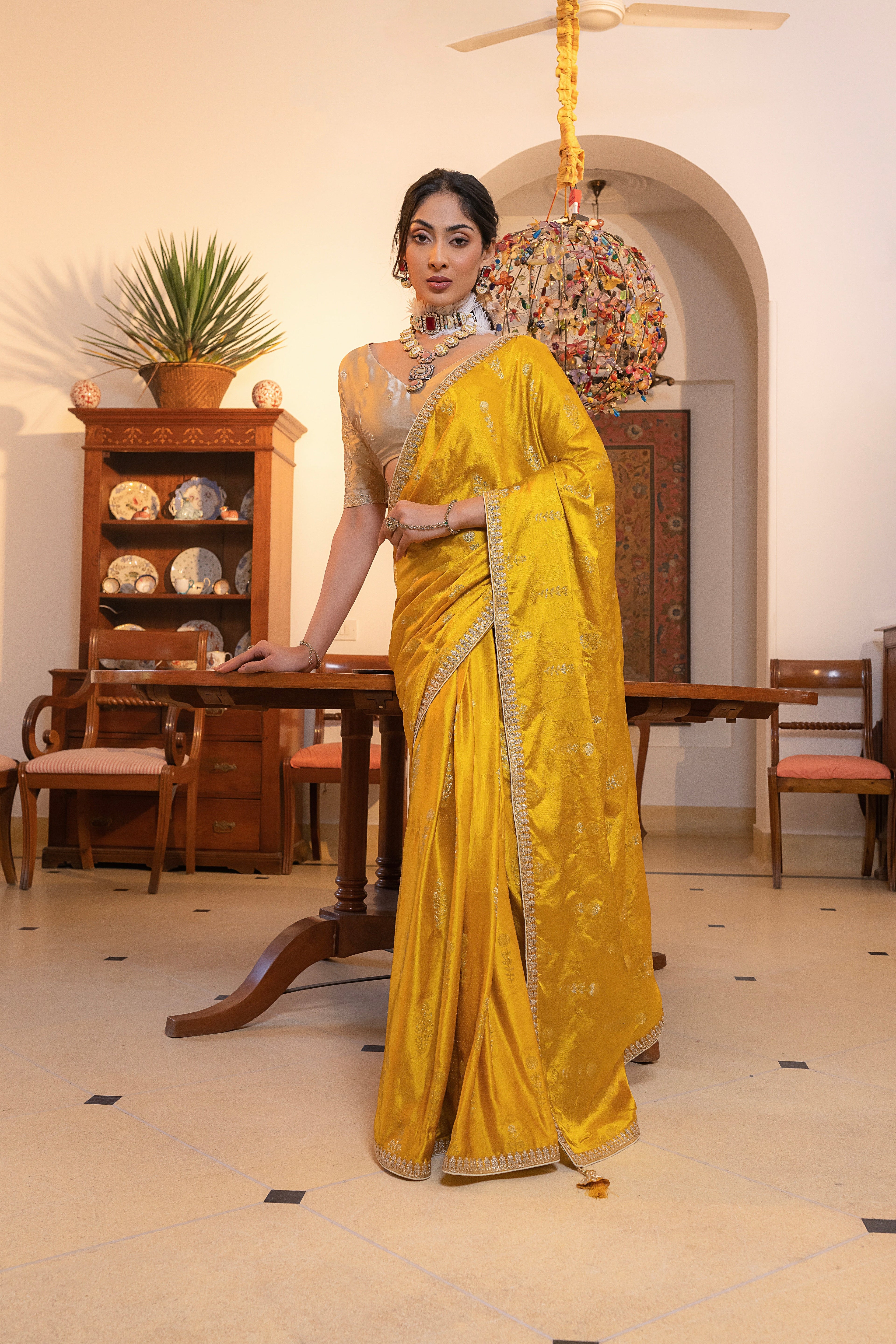 Yellow Viscose Satin Silk Saree with Zari Motifs and Sequin Embroidery