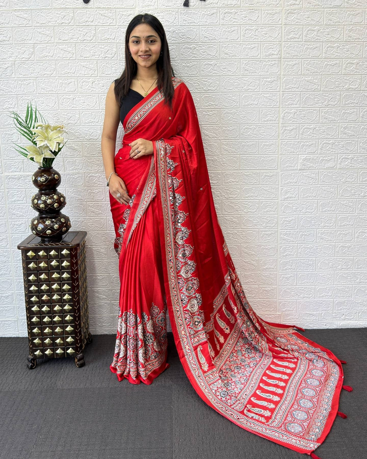 Ruby red modal silk saree with heritage paisley pallu intricate floral border traditional ethnic prints