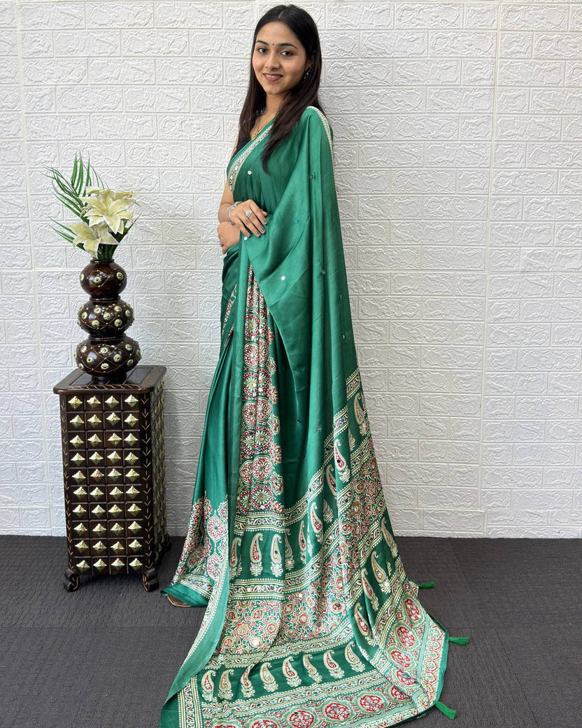 Emerald green modal silk saree with traditional paisley pallu floral border elegant ethnic prints