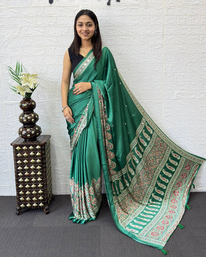 Emerald green modal silk saree with traditional paisley pallu floral border elegant ethnic prints mameraa