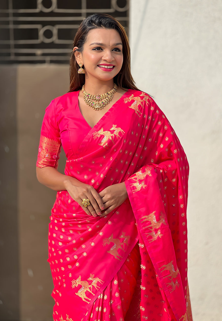 Pink soft silk dual zari woven saree with deer border