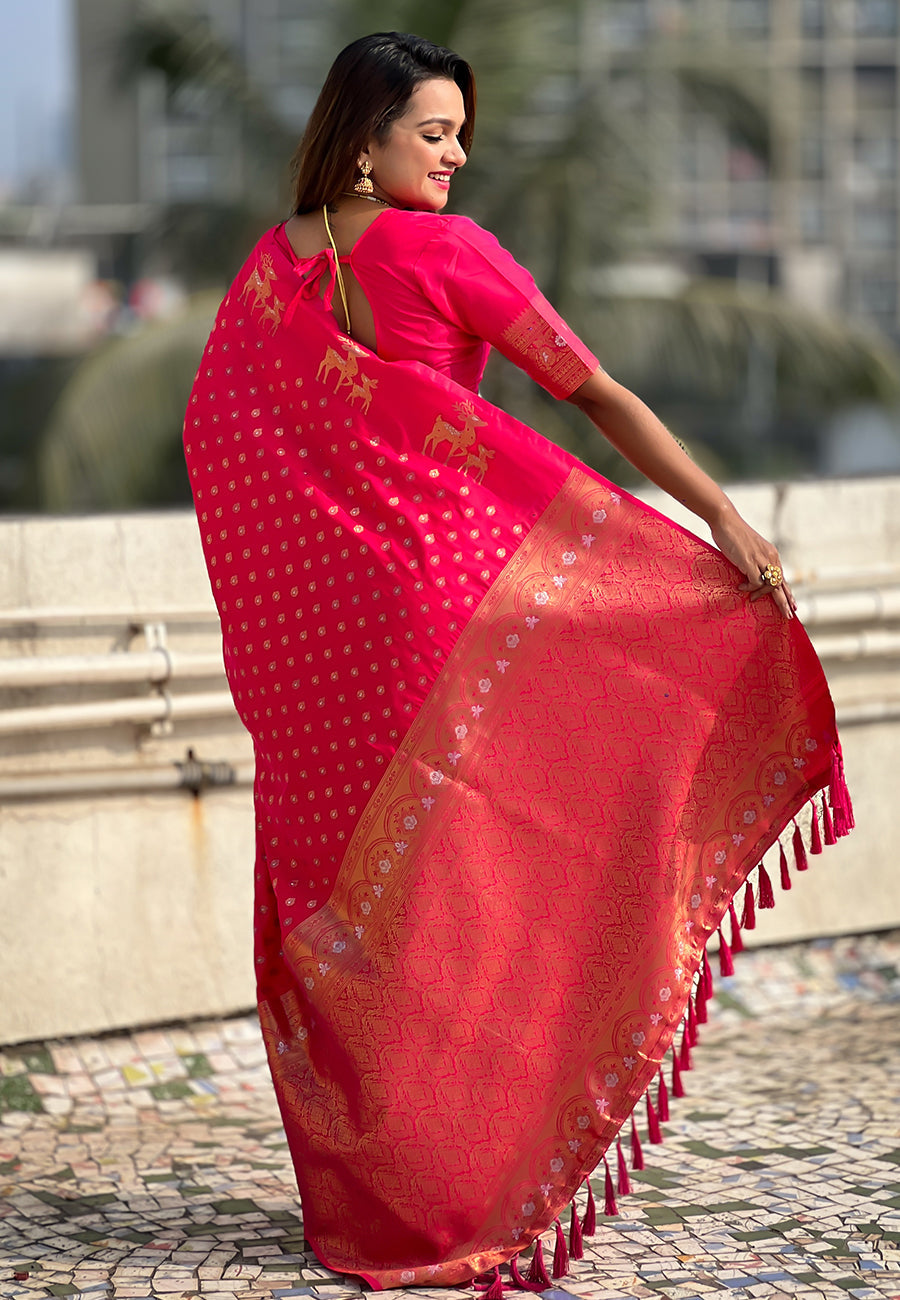 Pink soft silk dual zari woven saree with deer border