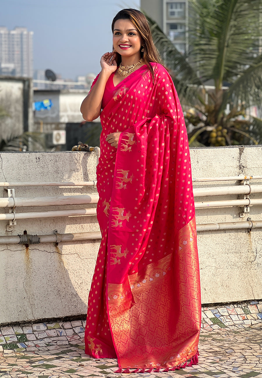 Pink soft silk dual zari woven saree with deer border