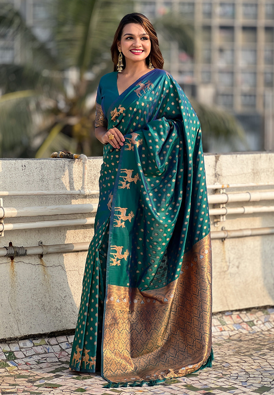 Green soft silk dual zari woven saree with deer border