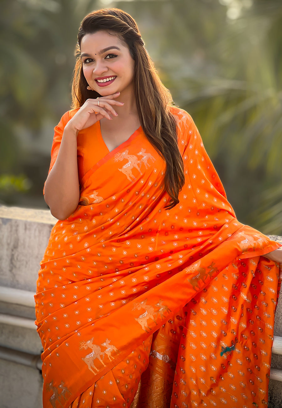 Orange soft silk dual zari woven saree with deer border