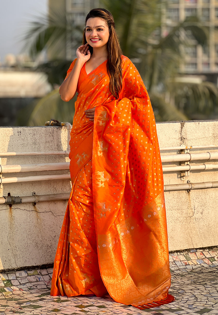 Orange soft silk dual zari woven saree with deer border