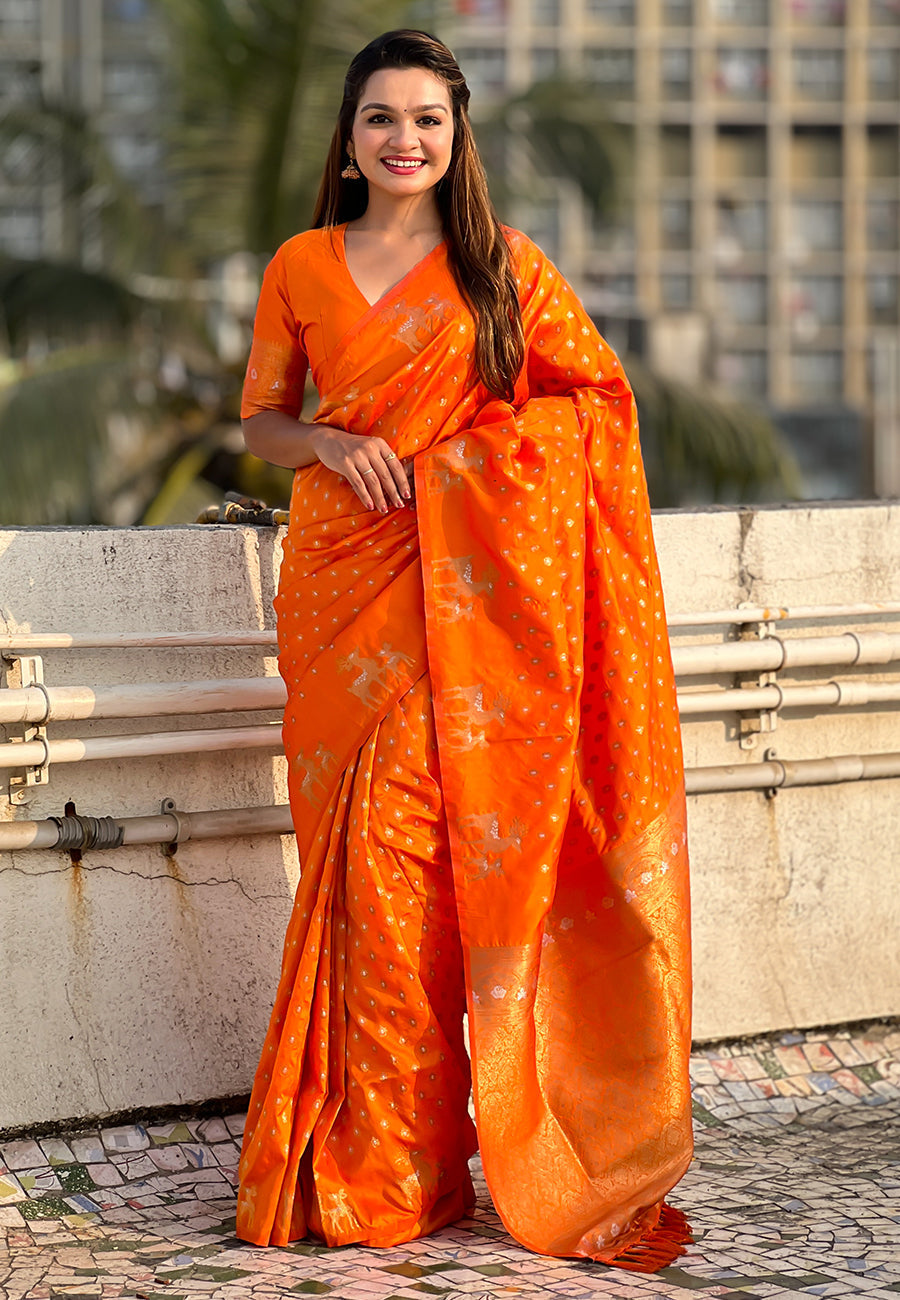 Orange soft silk dual zari woven saree with deer border