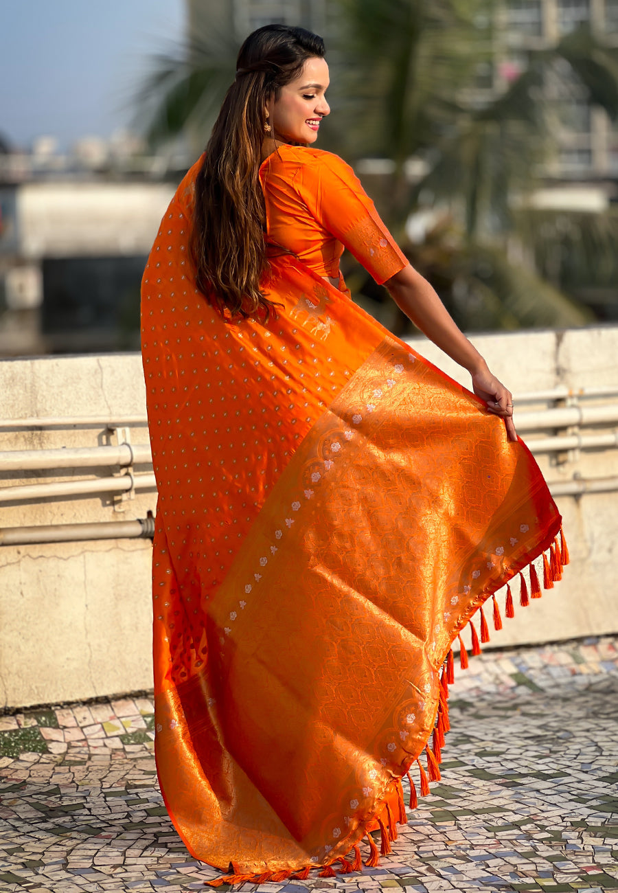 Orange soft silk dual zari woven saree with deer border