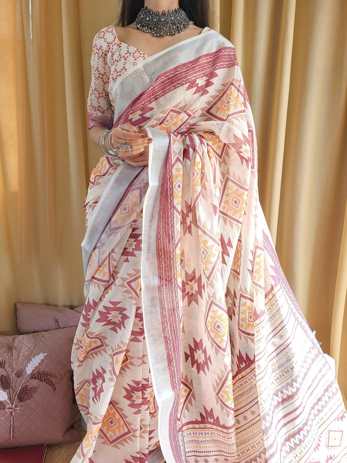 Ivory linen saree with geometric tribal prints tassel accents