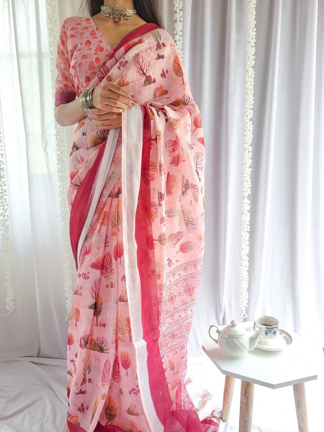 Blush pink handwoven linen saree with vibrant autumn motifs tassel detailing mameraa