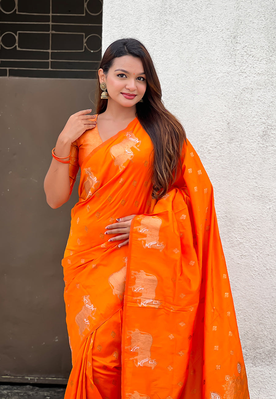 Orange soft silk dual zari woven saree with nandi border