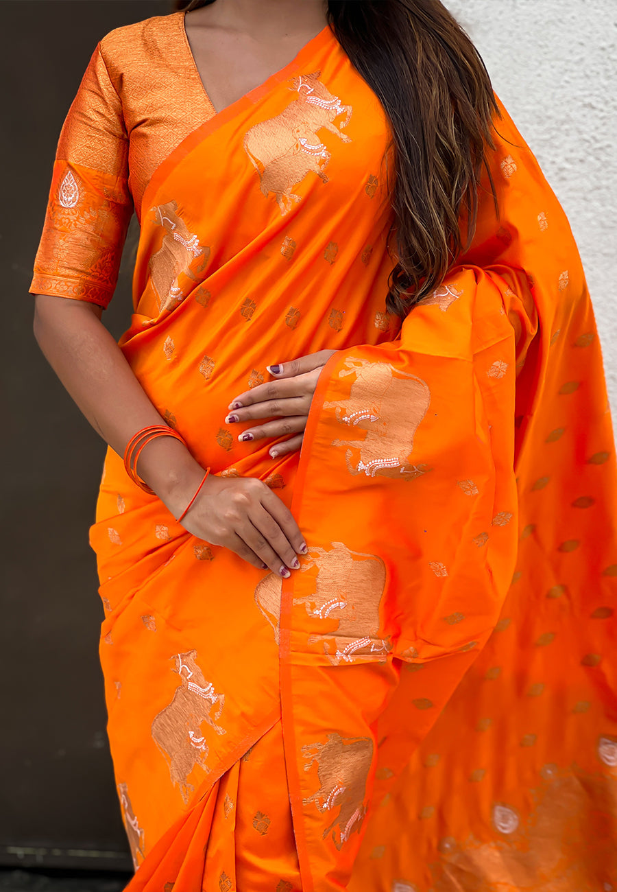 Orange soft silk dual zari woven saree with nandi border