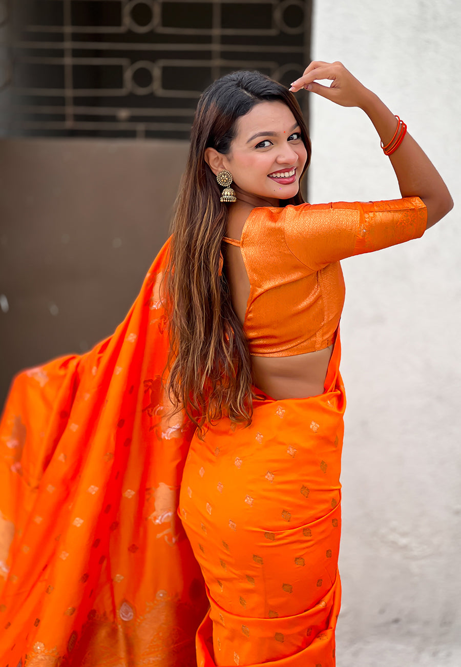 Orange soft silk dual zari woven saree with nandi border