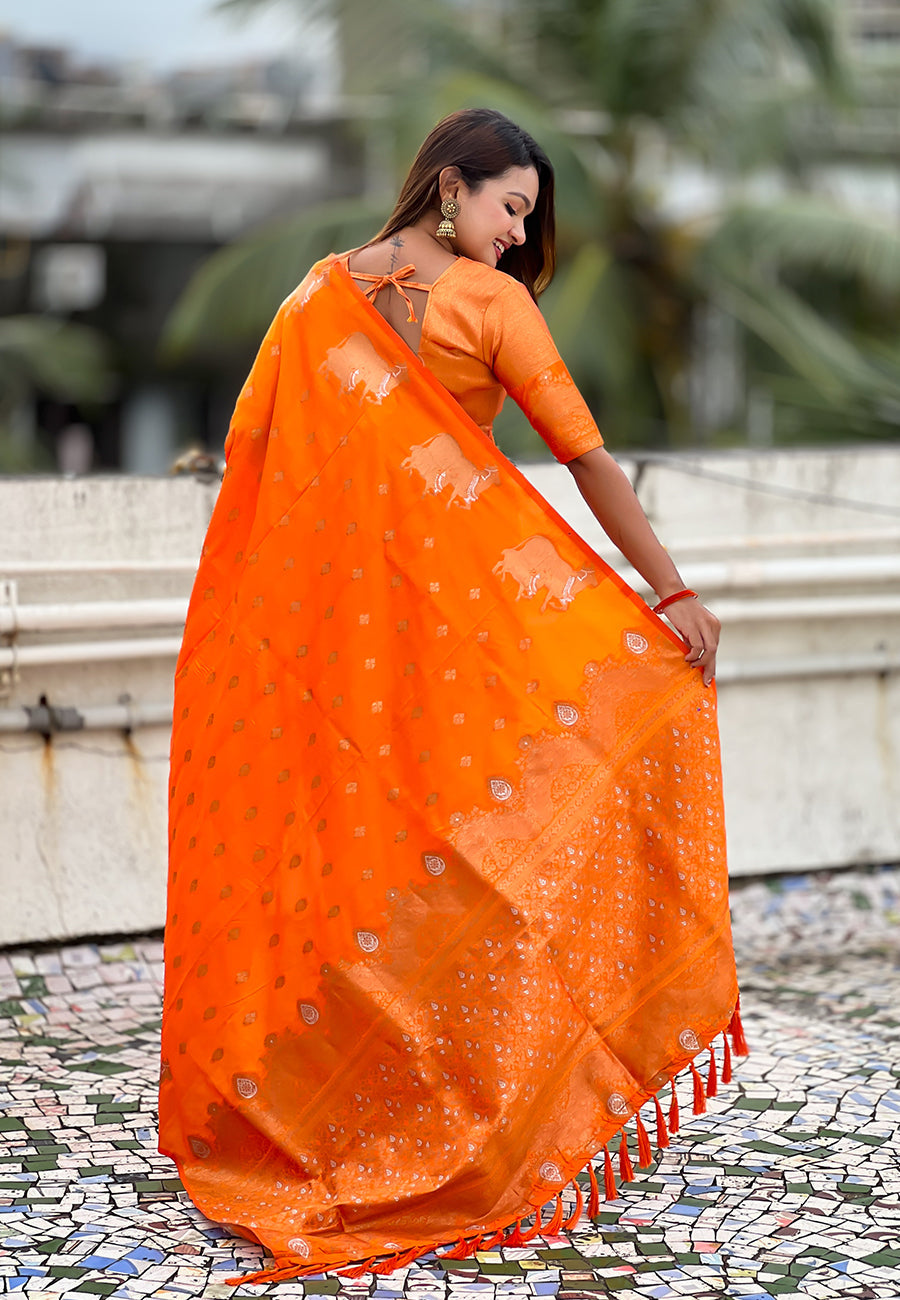 Orange soft silk dual zari woven saree with nandi border