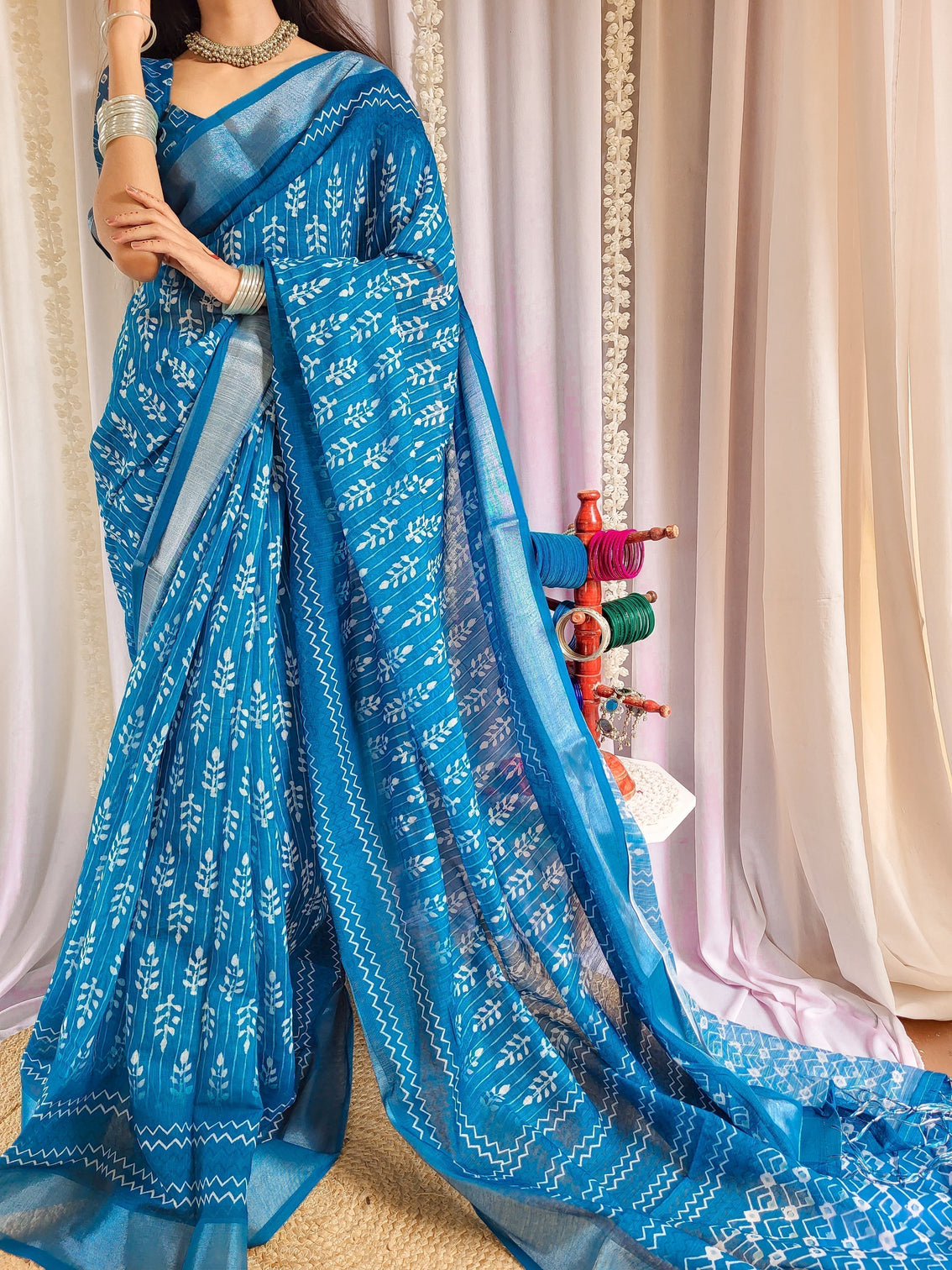 Elegant blue pure linen saree with tassels and white floral patterns mameraa