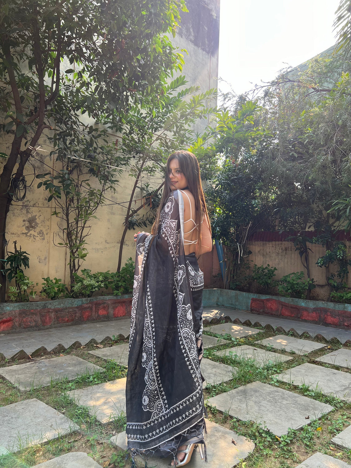 Black and white pure cotton linen saree with intricate floral design and tassels on edges