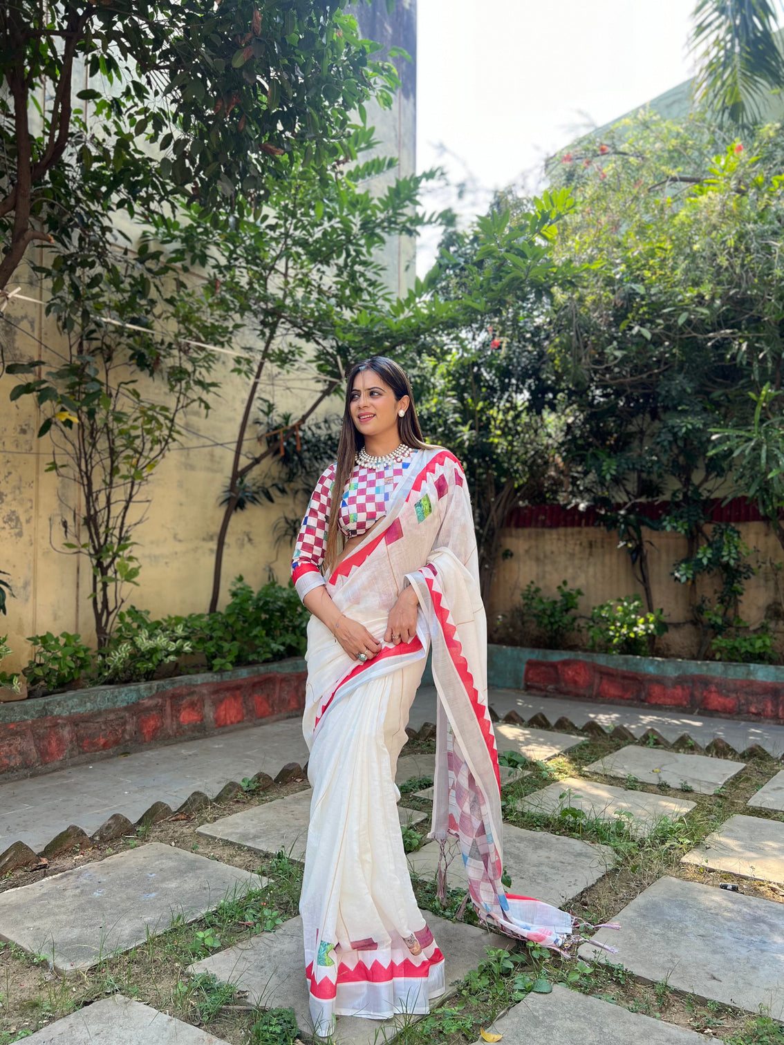 White pure cotton linen saree with multicolor checkered design blouse and tassel detailing