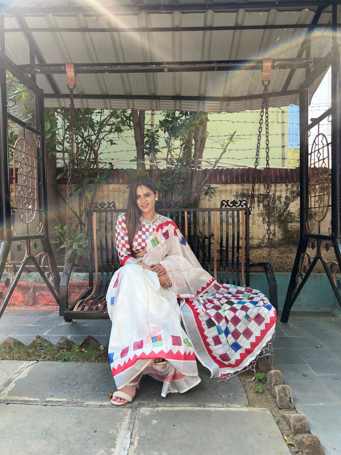 White pure cotton linen saree with multicolor checkered design blouse and tassel detailing