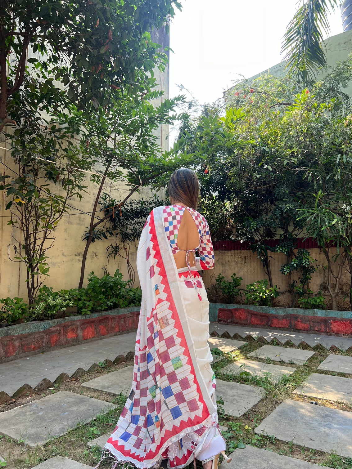 White pure cotton linen saree with multicolor checkered design blouse and tassel detailing