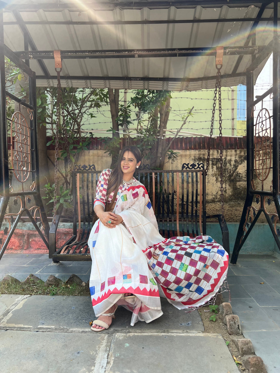 White pure cotton linen saree with multicolor checkered design blouse and tassel detailing