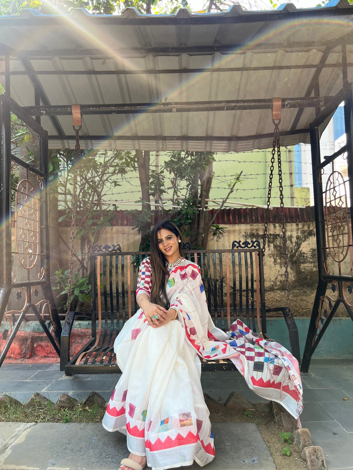 White pure cotton linen saree with multicolor checkered design blouse and tassel detailing