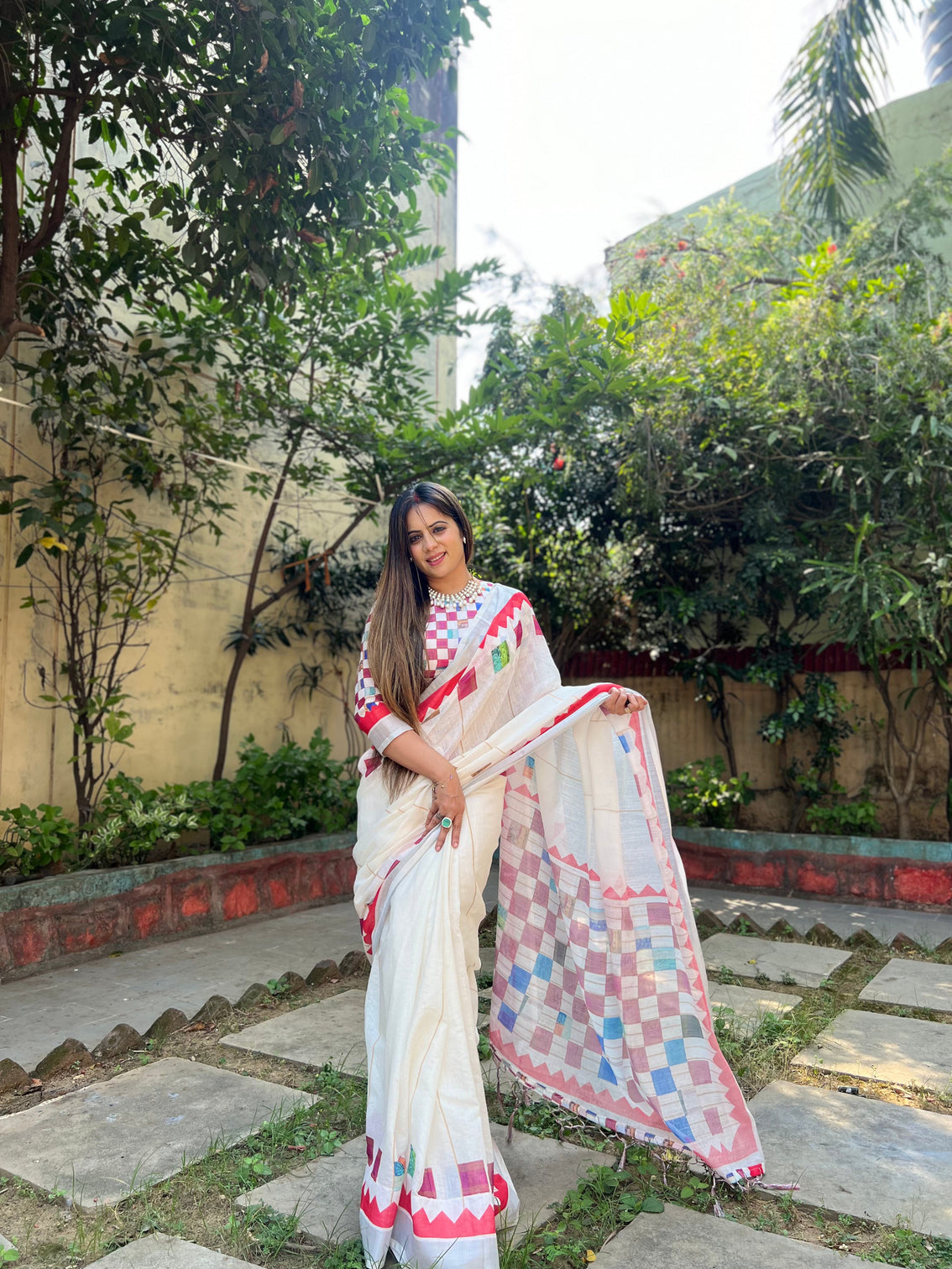 White pure cotton linen saree with multicolor checkered design blouse and tassel detailing