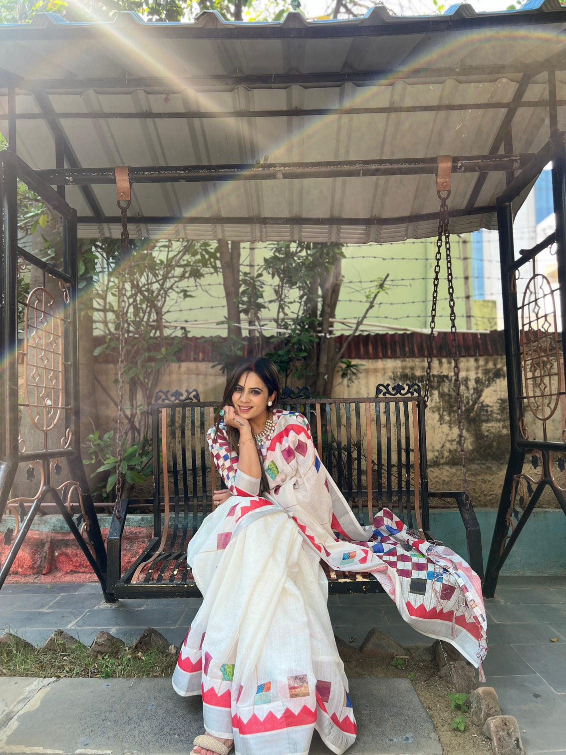White pure cotton linen saree with multicolor checkered design blouse and tassel detailing