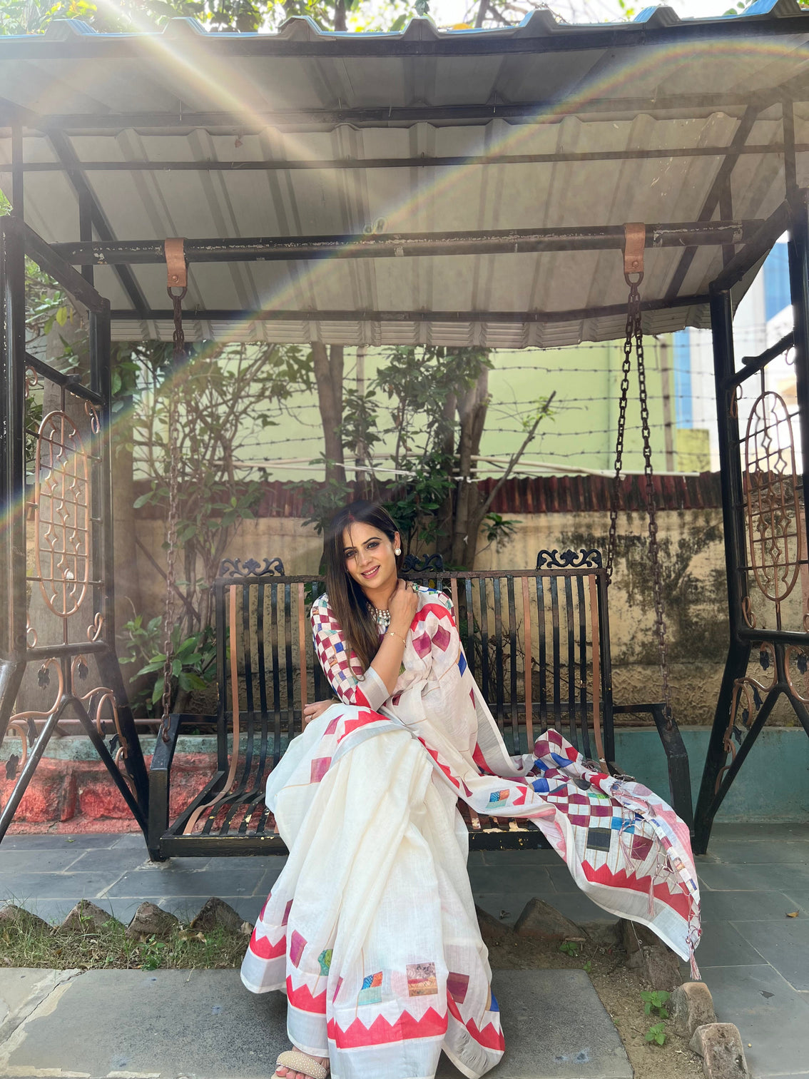 White pure cotton linen saree with multicolor checkered design blouse and tassel detailing