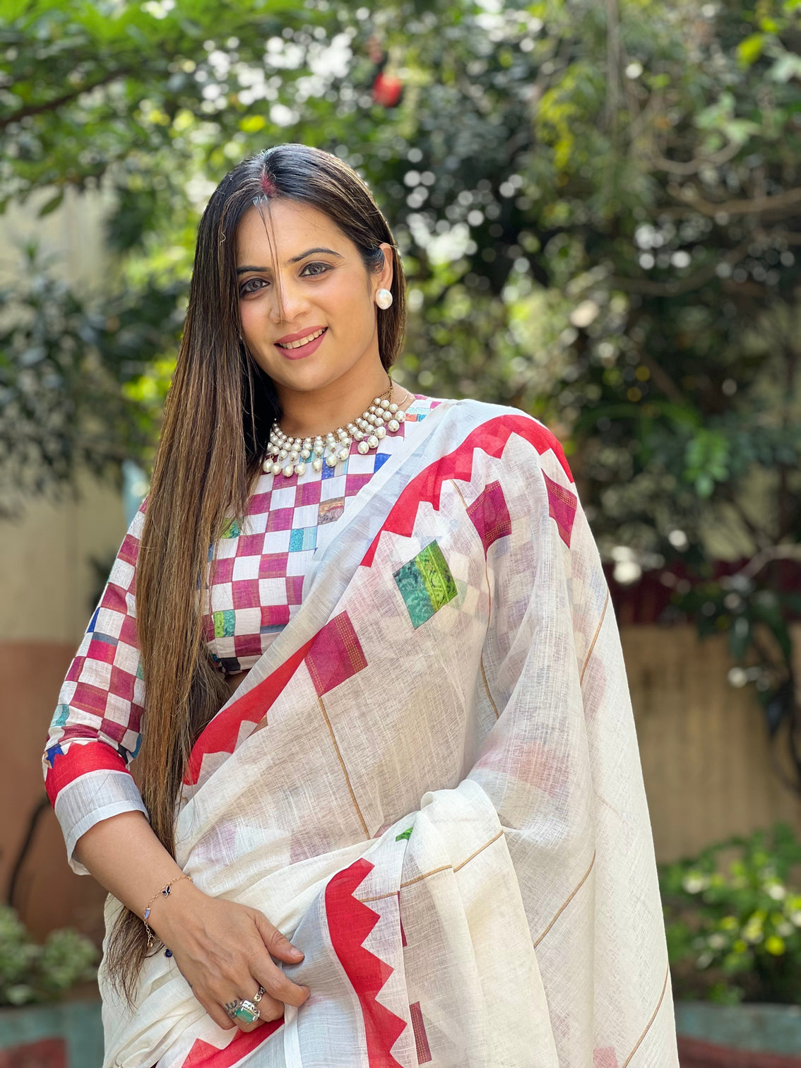 White pure cotton linen saree with multicolor checkered design blouse and tassel detailing