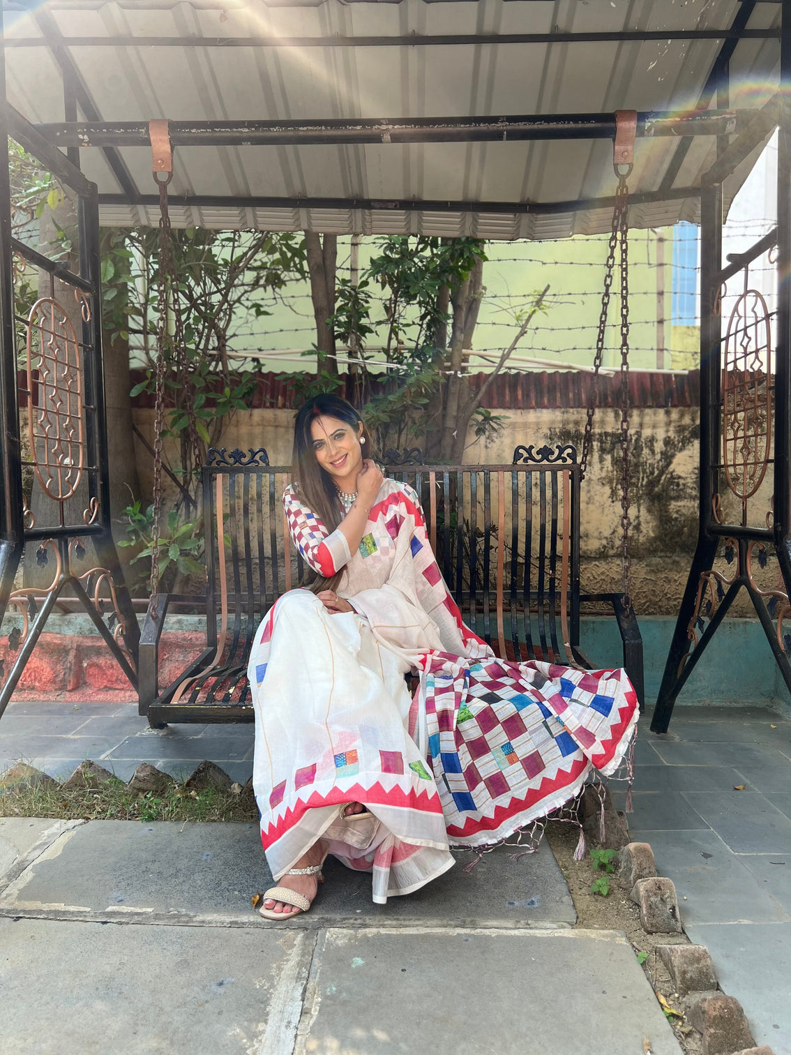 White pure cotton linen saree with multicolor checkered design blouse and tassel detailing
