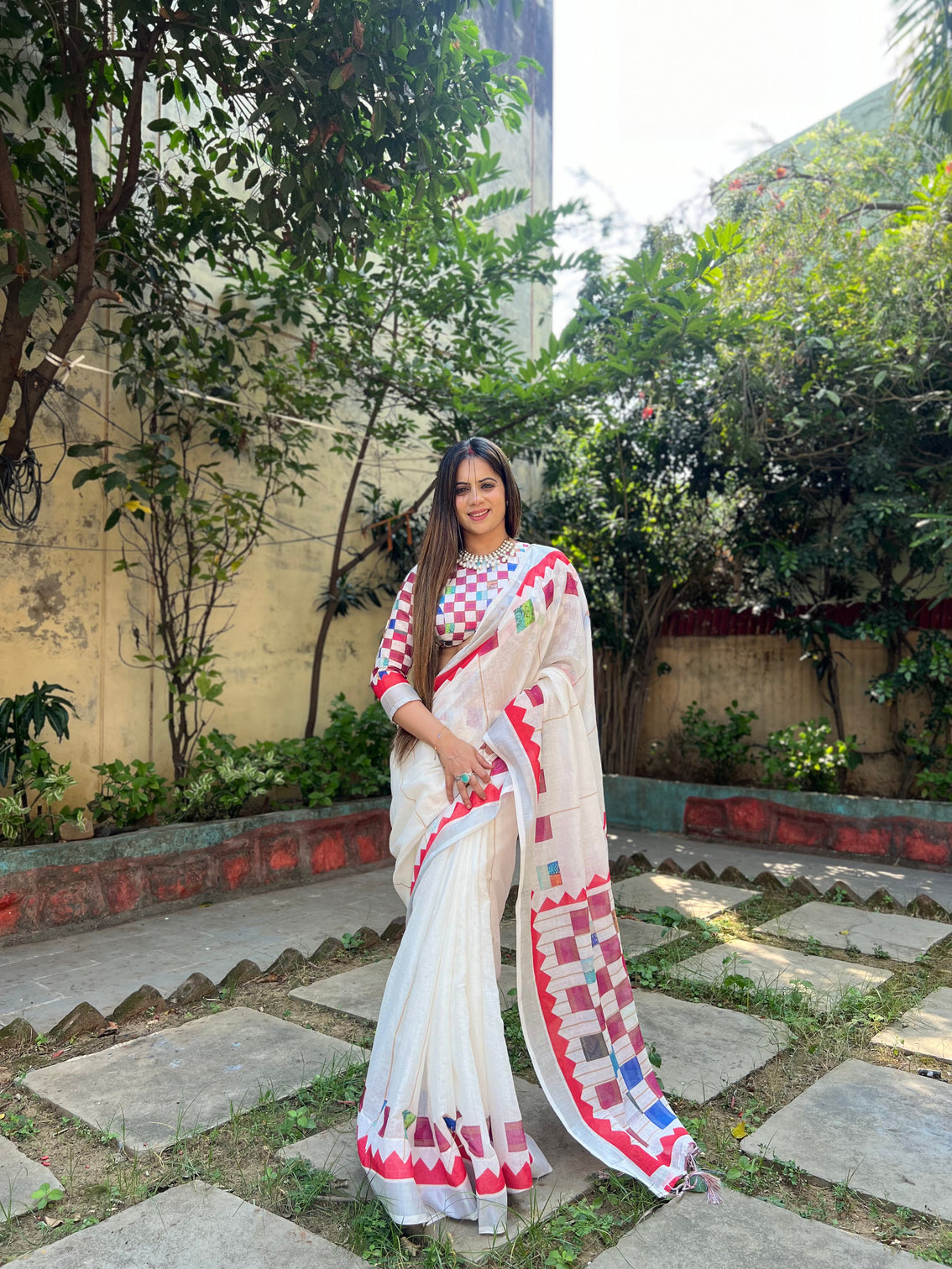 White pure cotton linen saree with multicolor checkered design blouse and tassel detailing