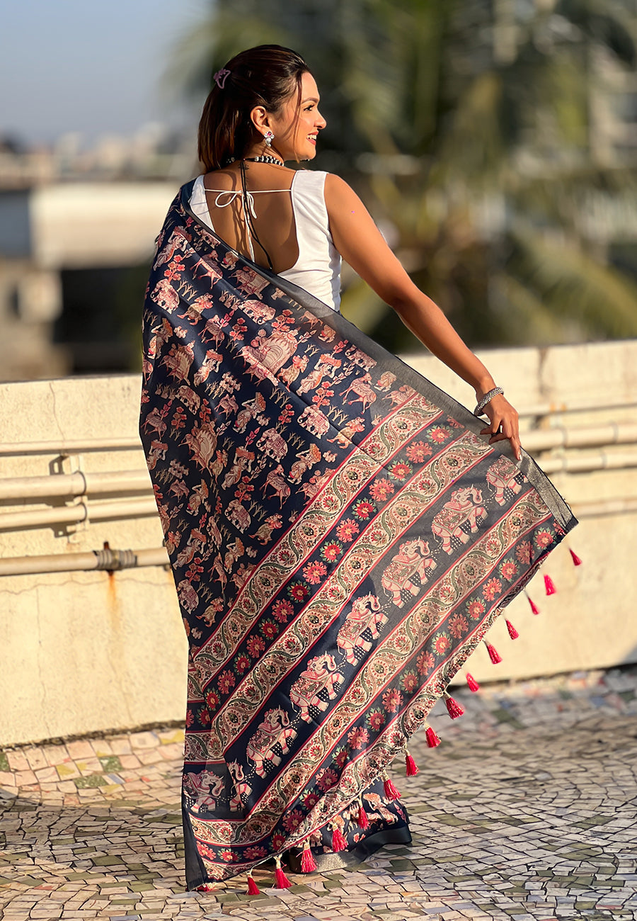 Dark blue tussar silk printed saree with zari woven border