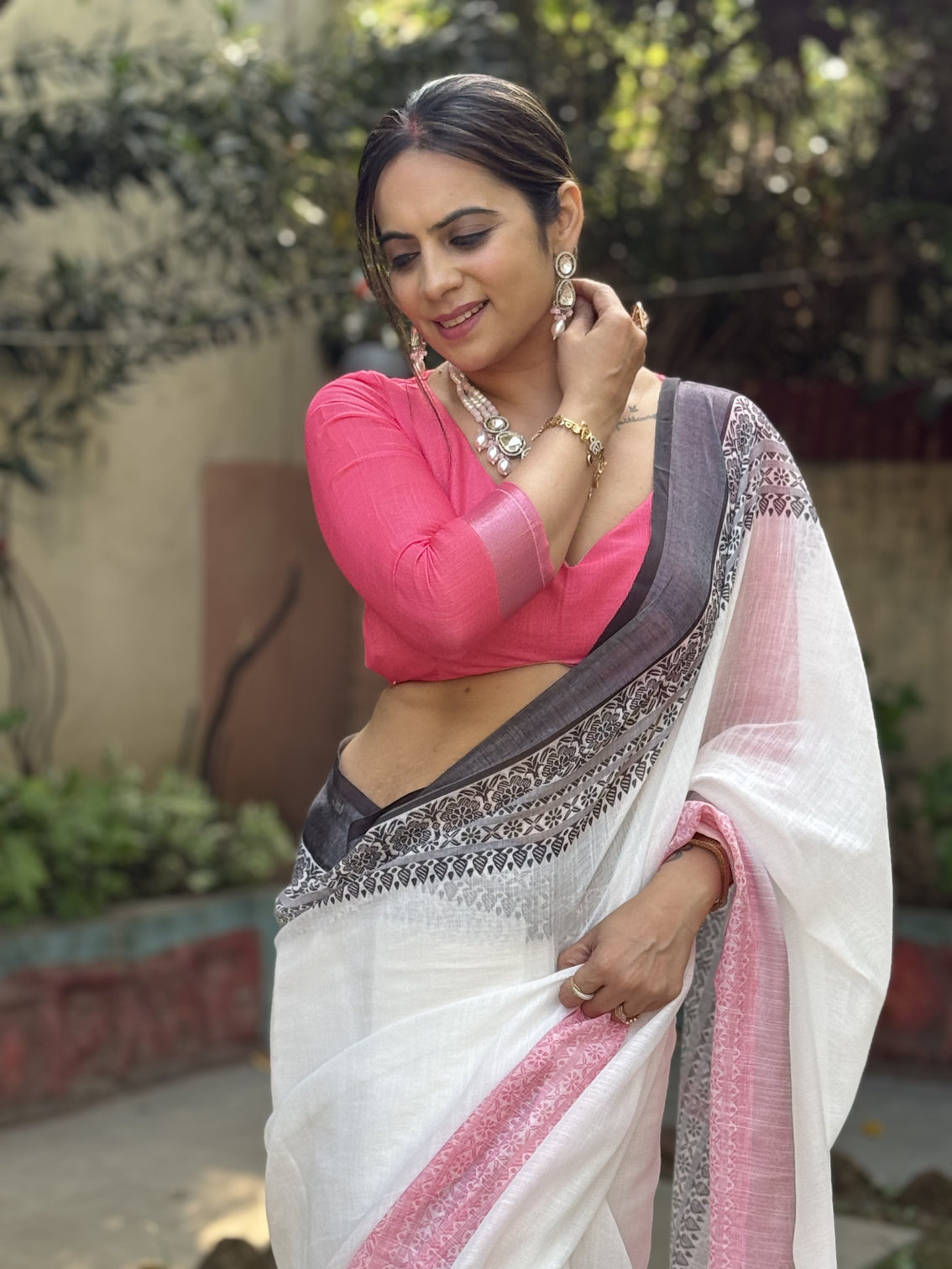 Elegant white and pink pure linen digital printed saree with black border tassels and blouse piece intricate floral and geometric design