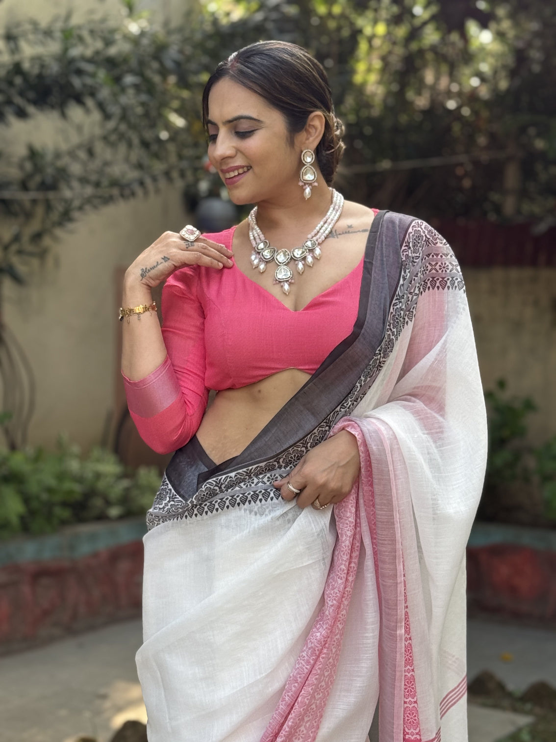 Elegant white and pink pure linen digital printed saree with black border tassels and blouse piece intricate floral and geometric design mameraa