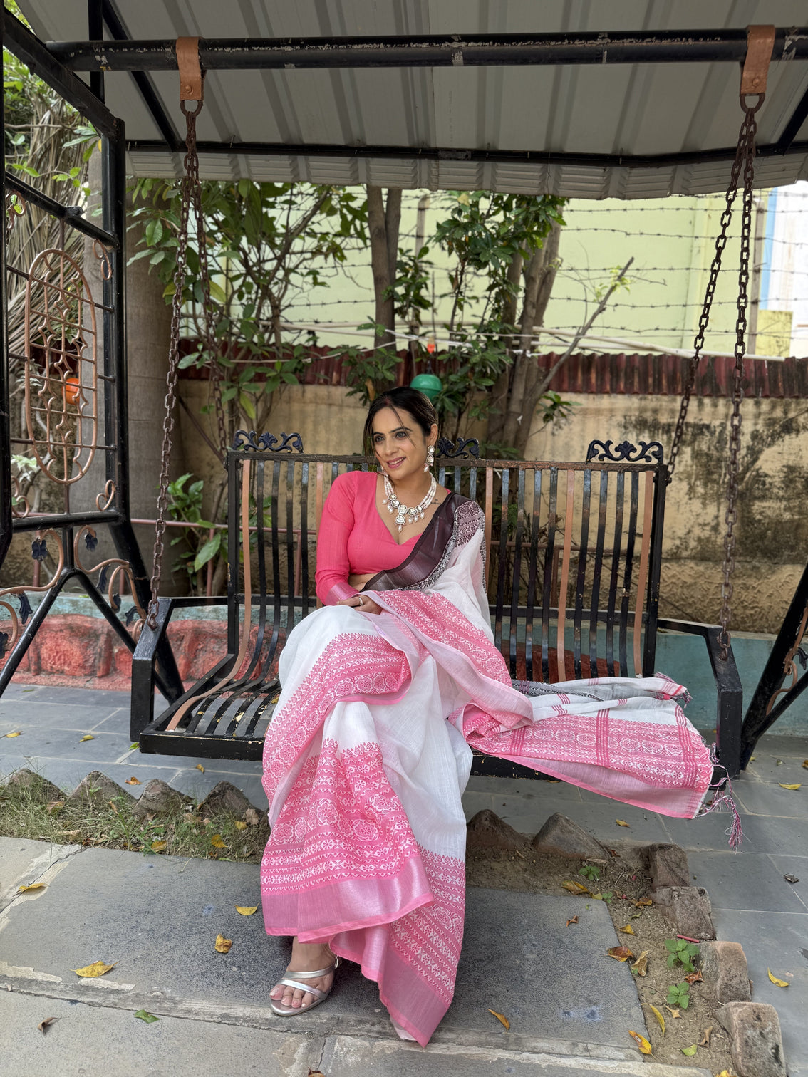 Elegant white and pink pure linen digital printed saree with black border tassels and blouse piece intricate floral and geometric design