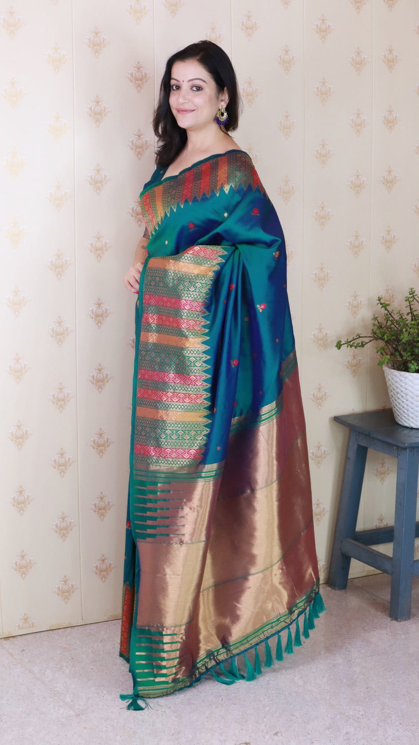 Green soft silk meenakari zari woven saree with temple border
