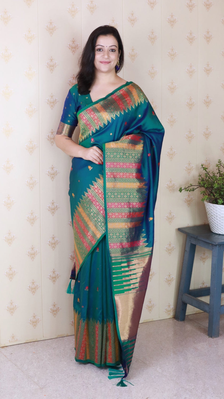 Green soft silk meenakari zari woven saree with temple border