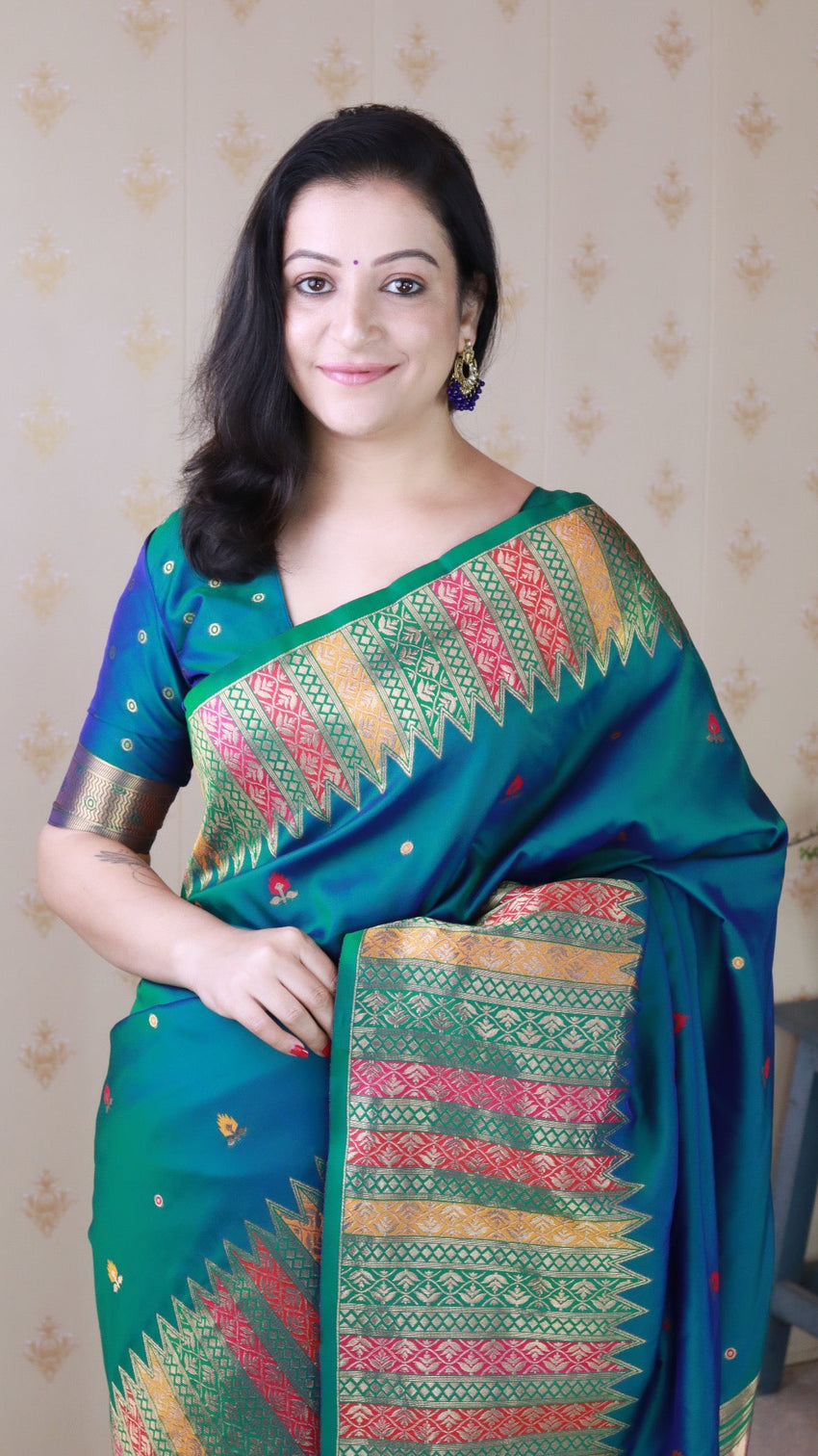 Green soft silk meenakari zari woven saree with temple border