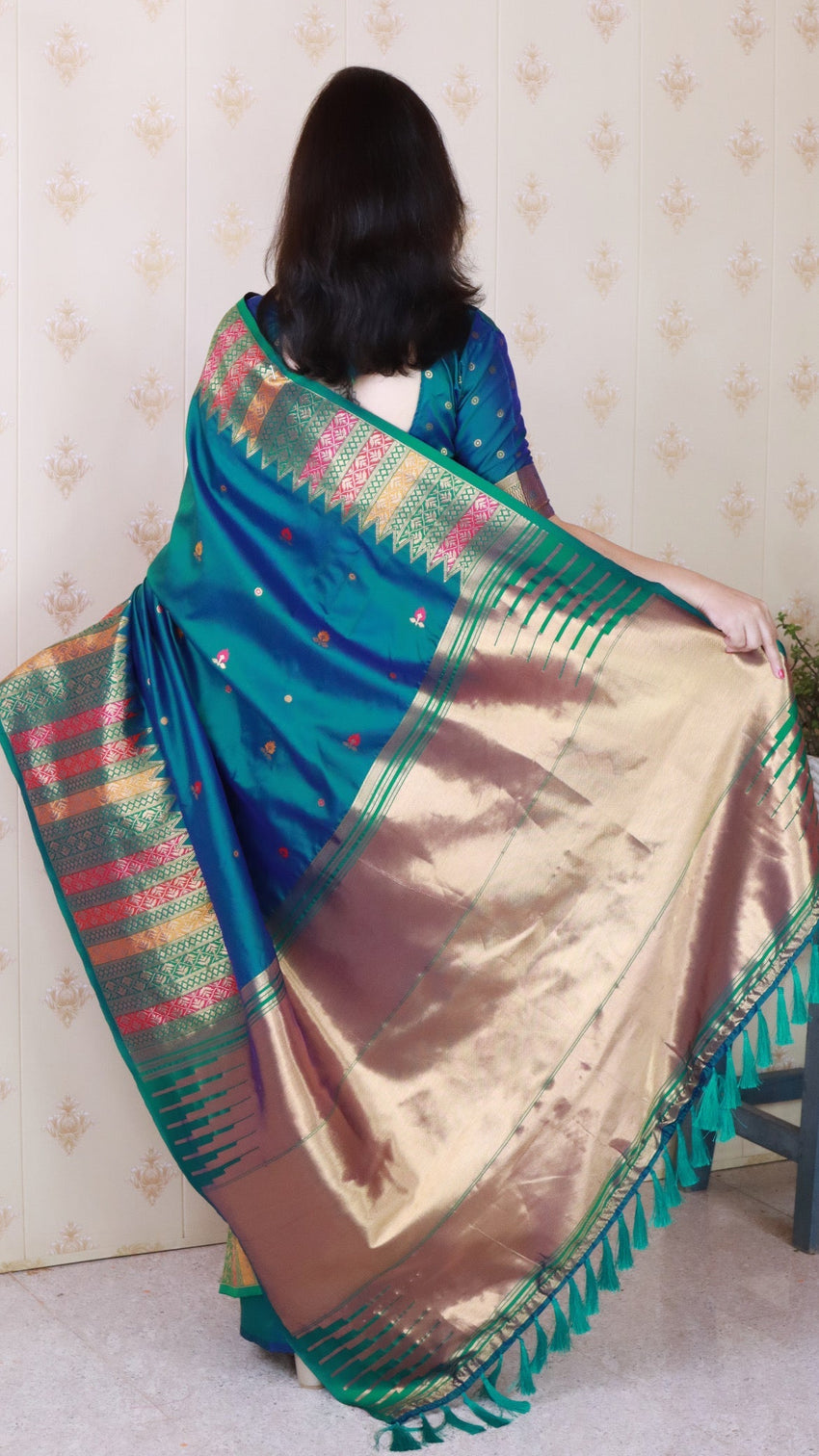 Green soft silk meenakari zari woven saree with temple border