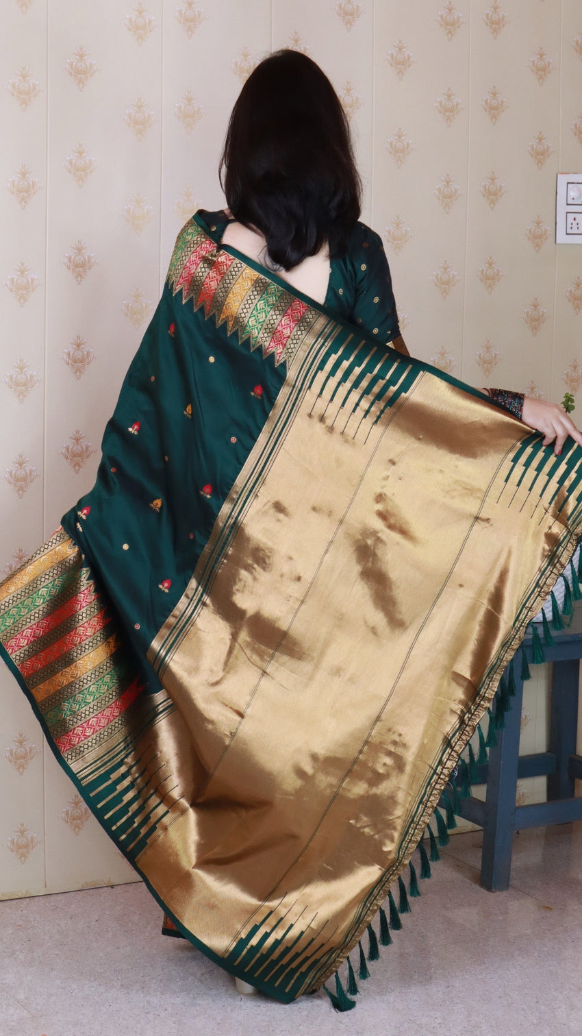 Bottle green soft silk meenakari zari woven saree with temple border