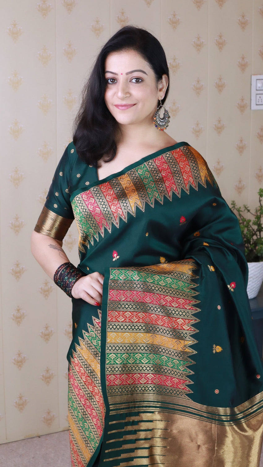 Bottle green soft silk meenakari zari woven saree with temple border