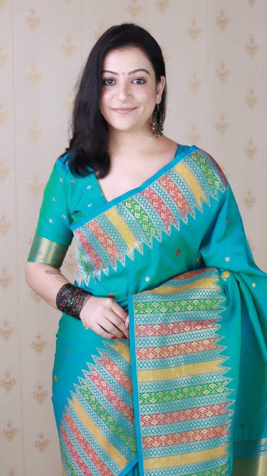 Aqua blue soft silk meenakari zari woven saree with temple border